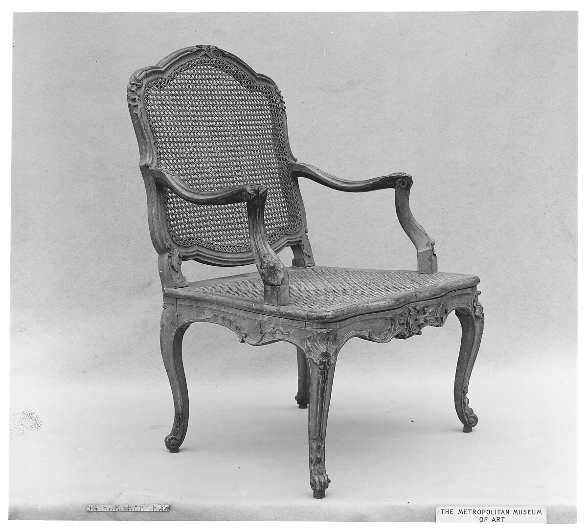 Armchair (fauteuil), Carved and painted fruitwood; caned back and seat, French 