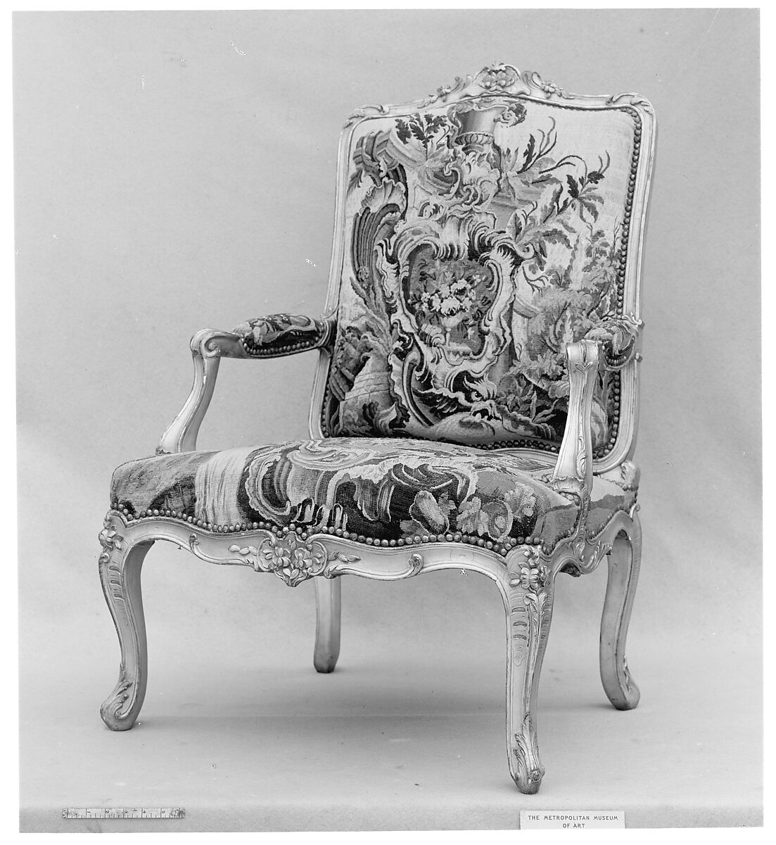 Pair of armchairs, Carved and gilded walnut; red damask upholstery, French