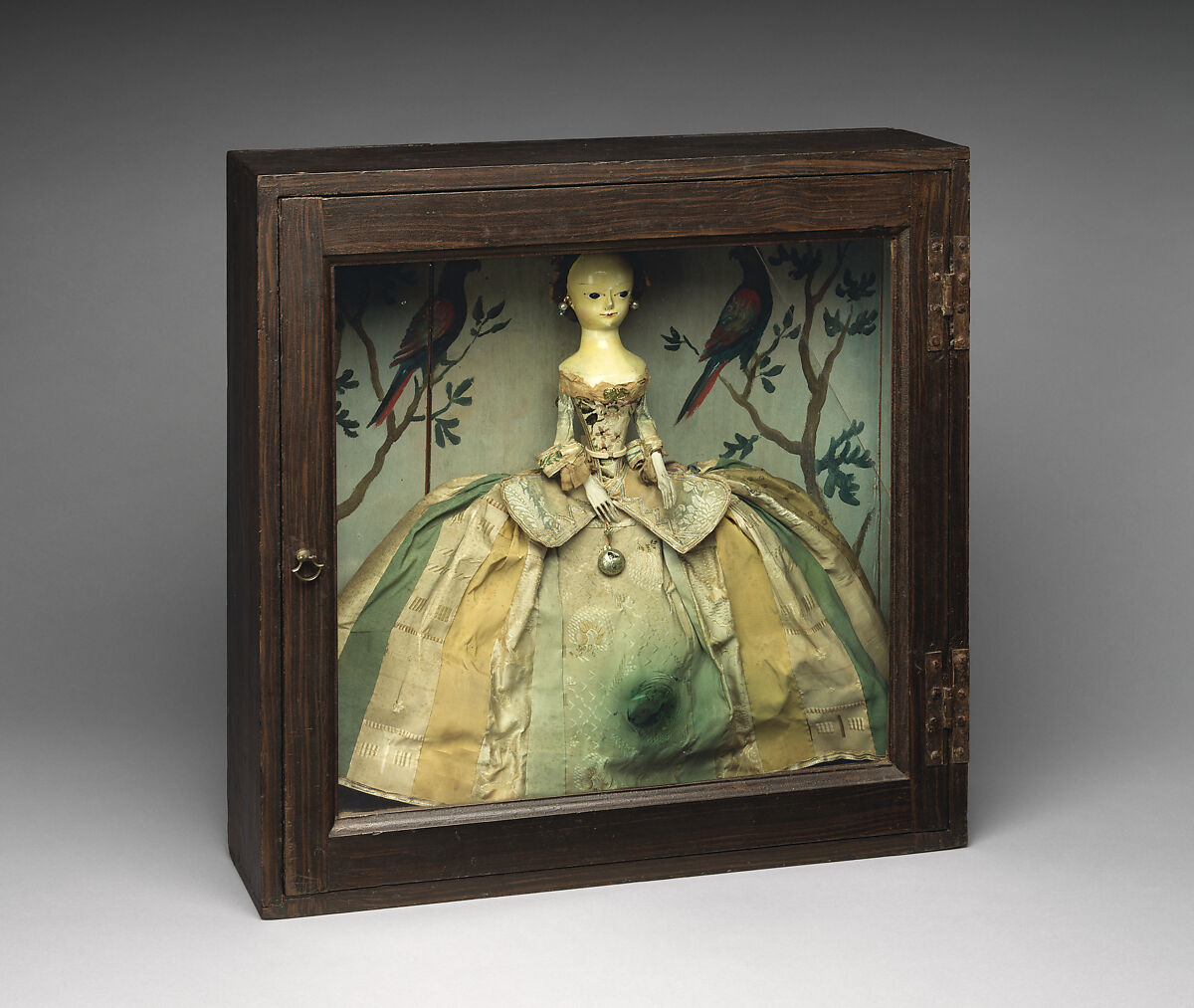 Doll in a box, Doll: Wood, paint, glass, silk, human hairBox: White pine, crown glass, paint, metal, British (Doll) and American (Box)