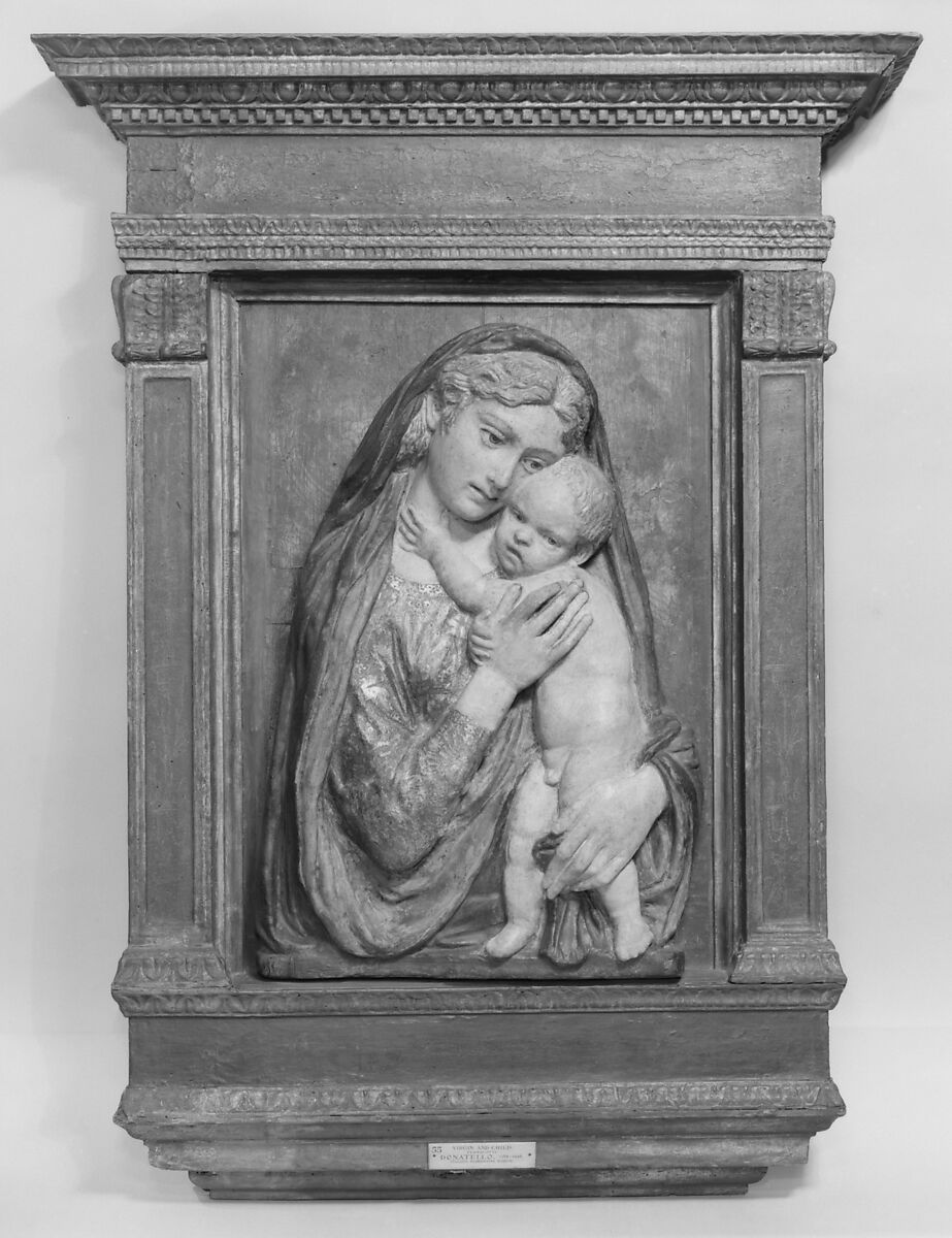 Madonna and Child, School of Donatello (Italian, Florence ca. 1386–1466 Florence), Figures: terracotta, polychromed and gilded; later background: wood, painted to represent brocade; frame: carved and painted, mouldings gilt, Italian 