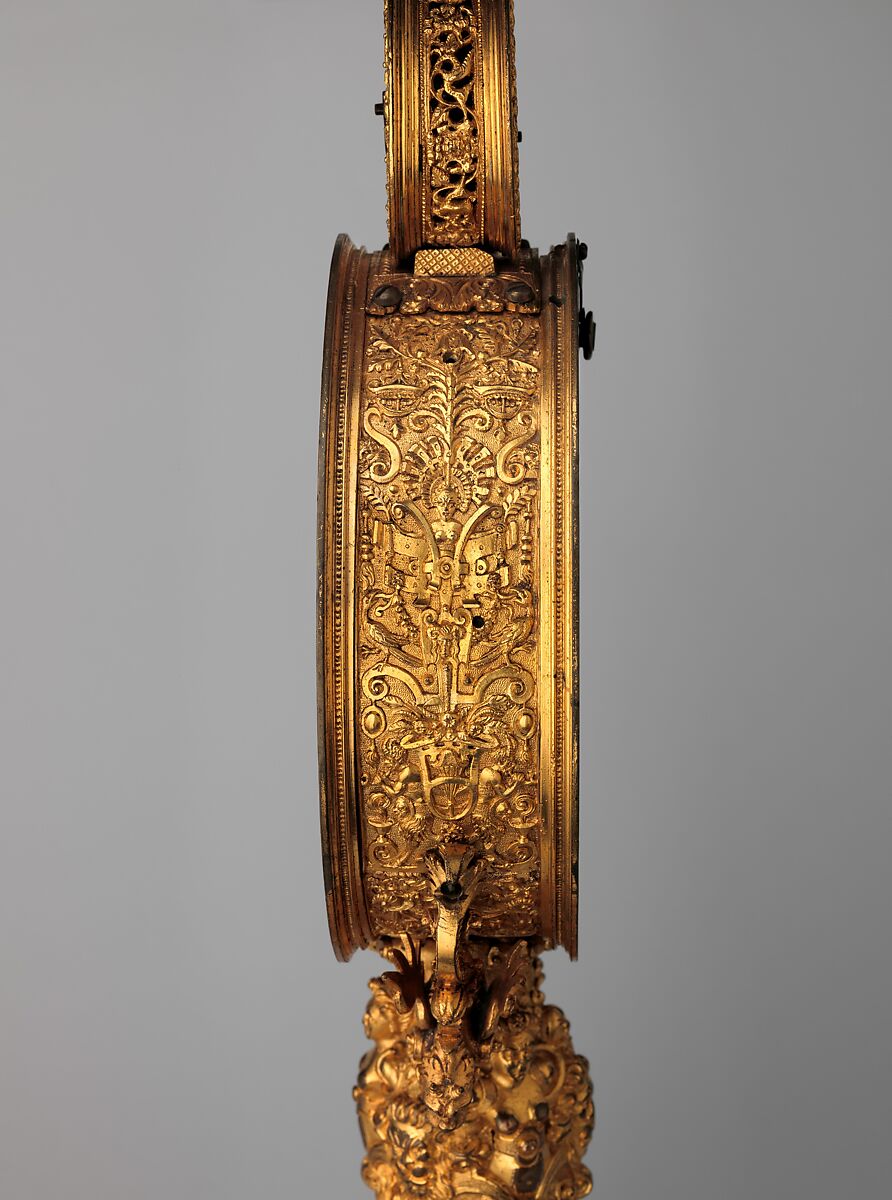 Mirror clock, Movement attributed to Master CR (probably active before 1565), Case: gilded brass and gilded copper; Dial: gilded brass; Movement: plated frame of iron, iron wheels, German, Nuremberg