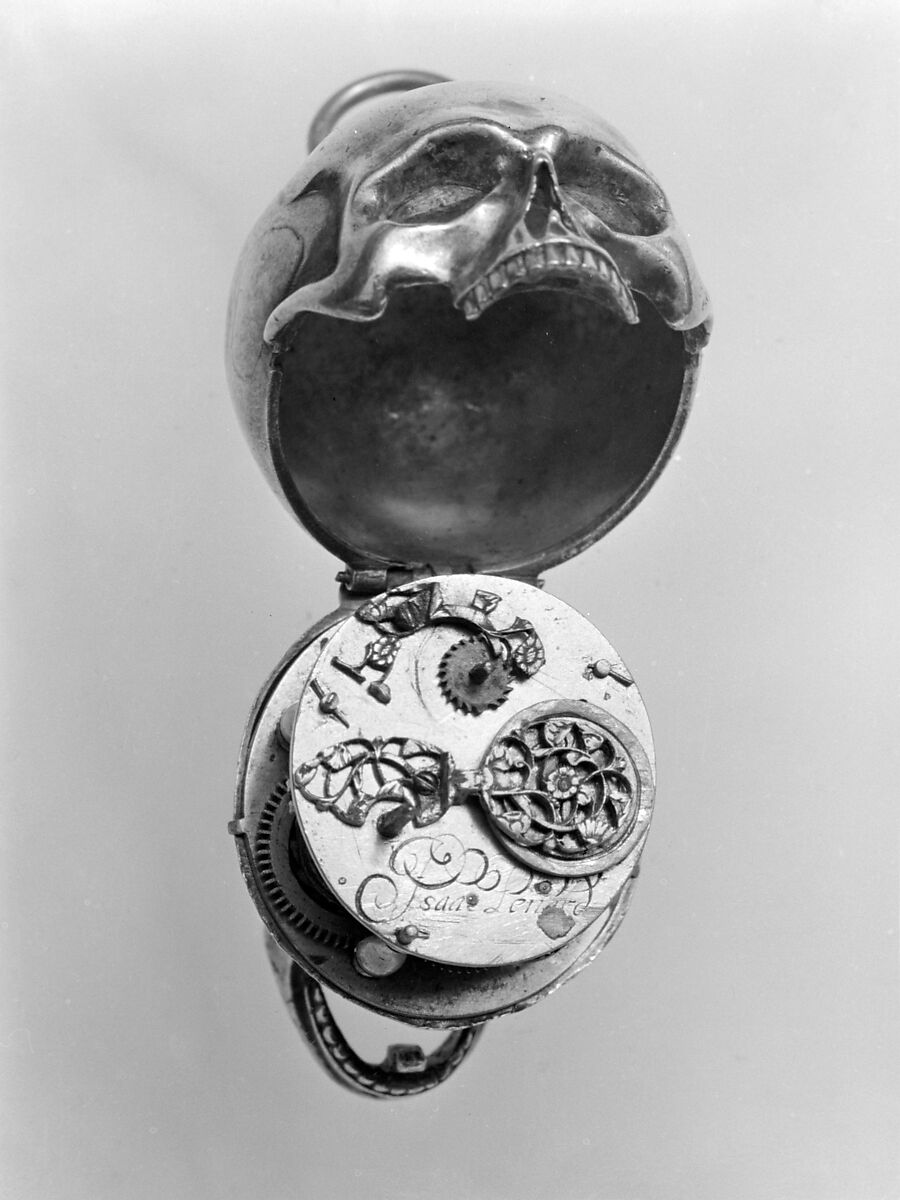 Watch in the form of a human skull, Watchmaker: Isaac Penard (Swiss, 1619–1676), Case: silver; Dial: silver, partly nielloed; Movement: gilded brass and steel, Swiss, Geneva