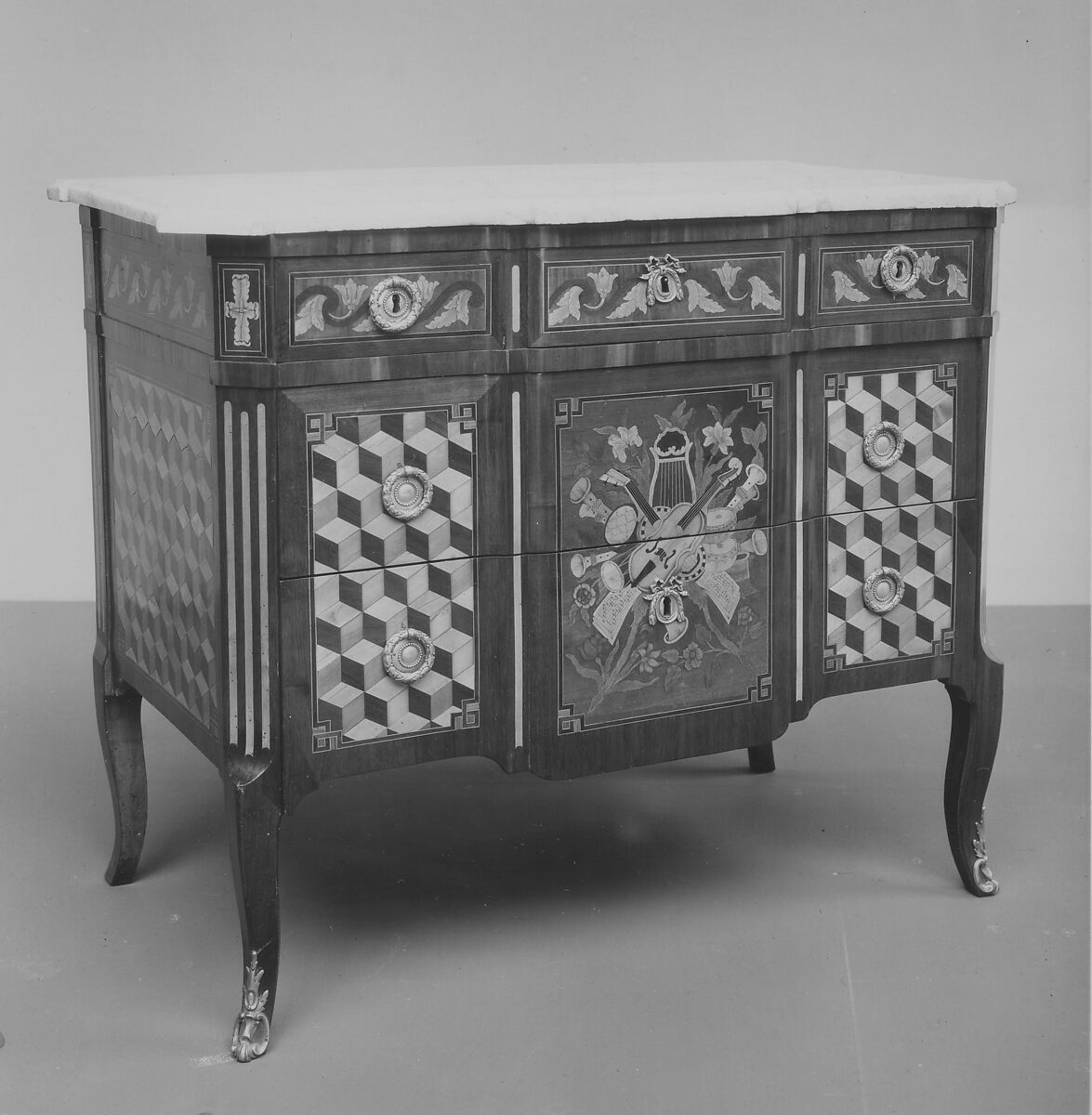 Commode, Marquetry of various woods, gilt bronze, white marble top, French 