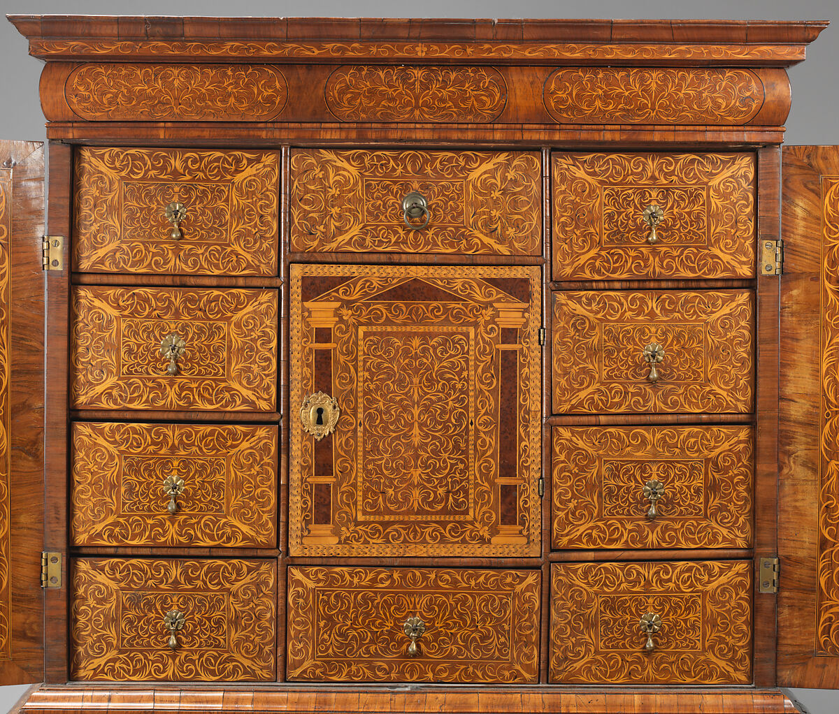Cabinet on stand, Pine veneered with marquetry of walnut, burl; walnut and holly; oak drawers; brass hardware, British