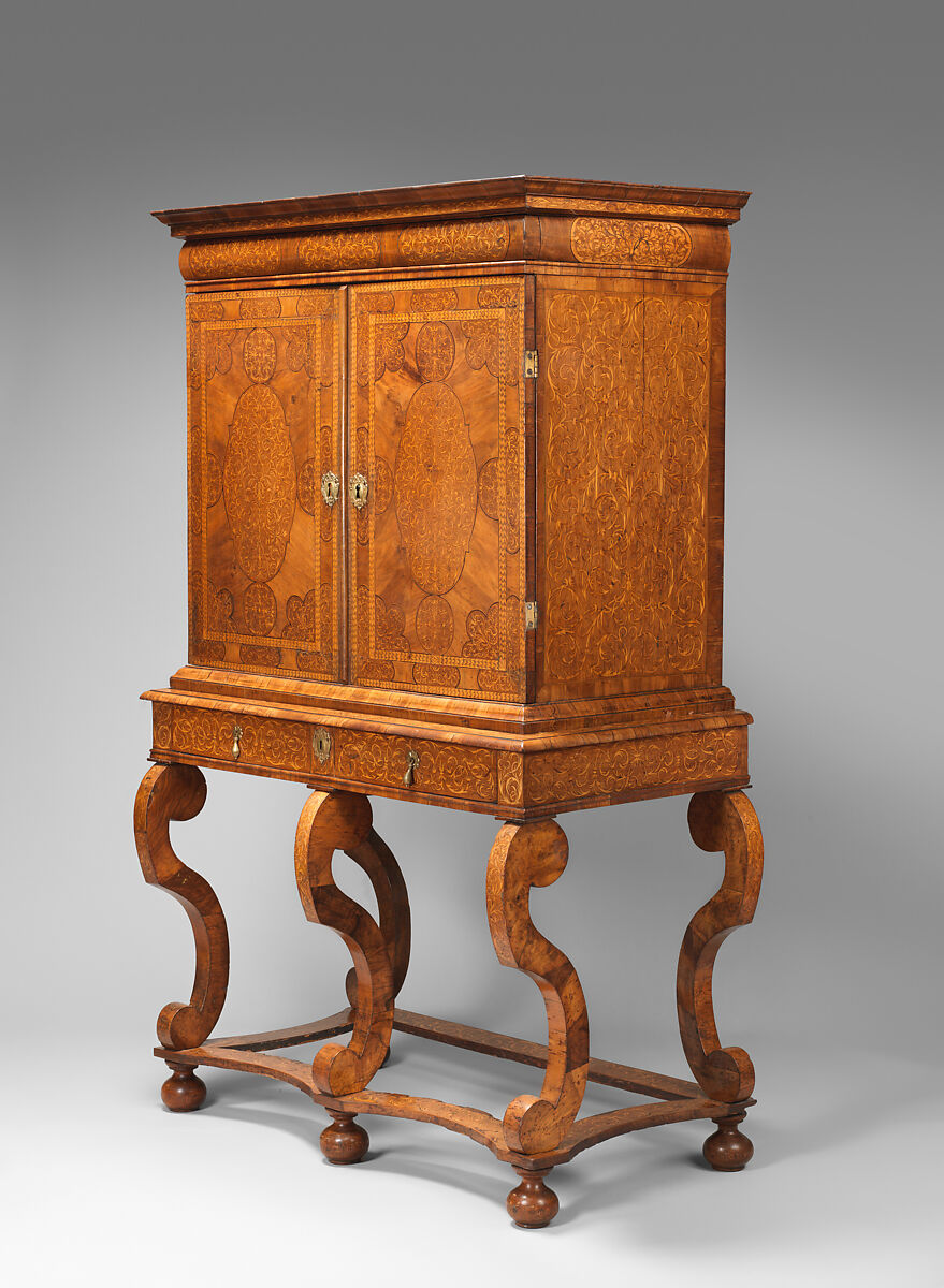 Cabinet on stand, Pine veneered with marquetry of walnut, burl; walnut and holly; oak drawers; brass hardware, British