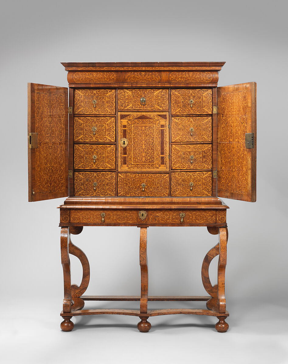 Cabinet on stand, Pine veneered with marquetry of walnut, burl; walnut and holly; oak drawers; brass hardware, British