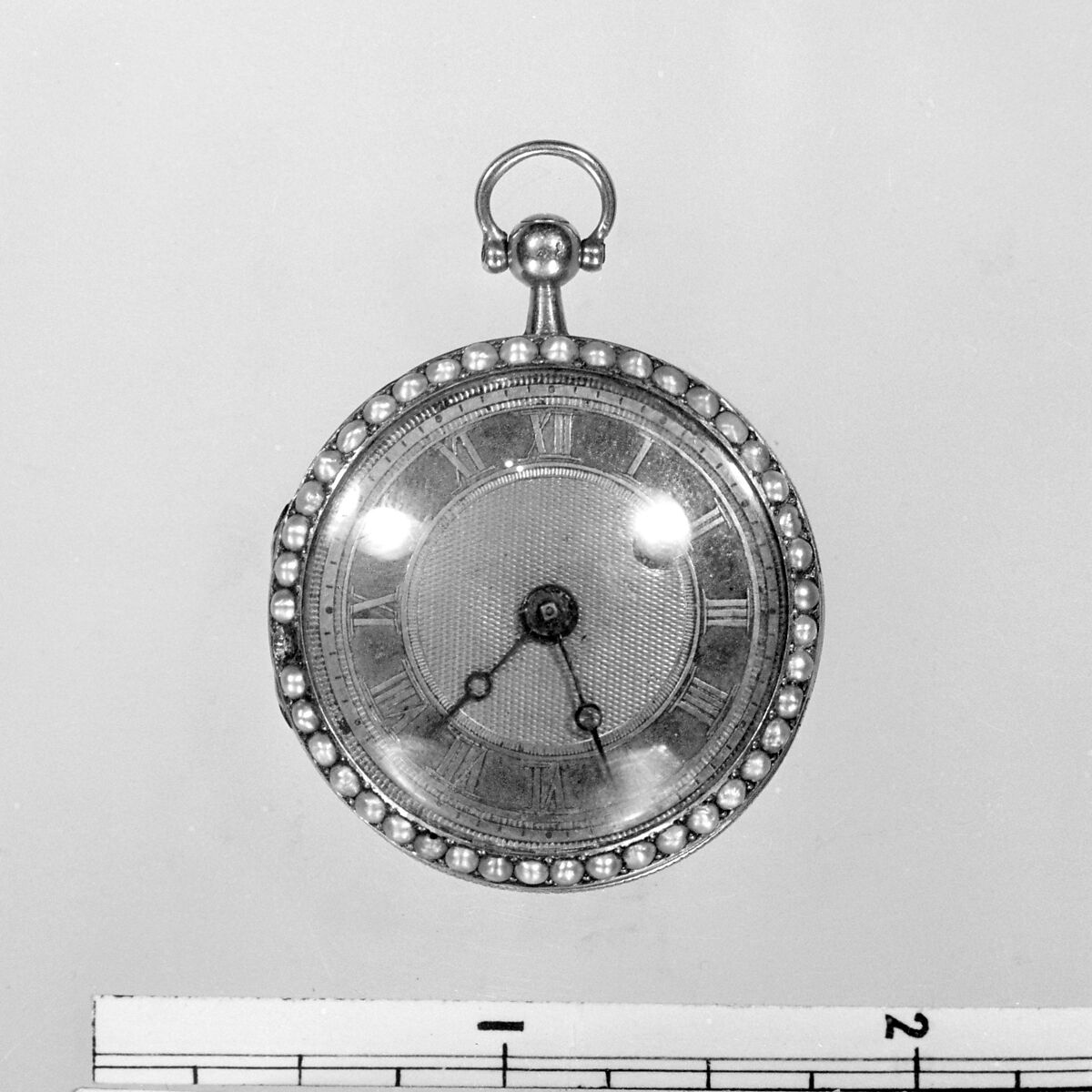 Watch, Case of gold and pearls, with radiating design of turqoises, French or Swiss