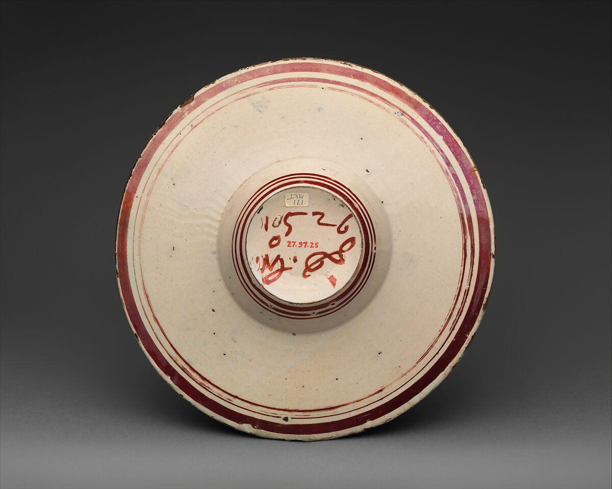 Wide-rimmed bowl with winged putto, Workshop of Maestro Giorgio Andreoli (Italian (Gubbio), active first half of 16th century), Maiolica (tin-glazed earthenware), lustered, Italian, Gubbio