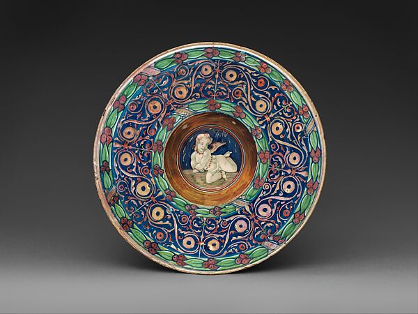 Wide-rimmed bowl with winged putto