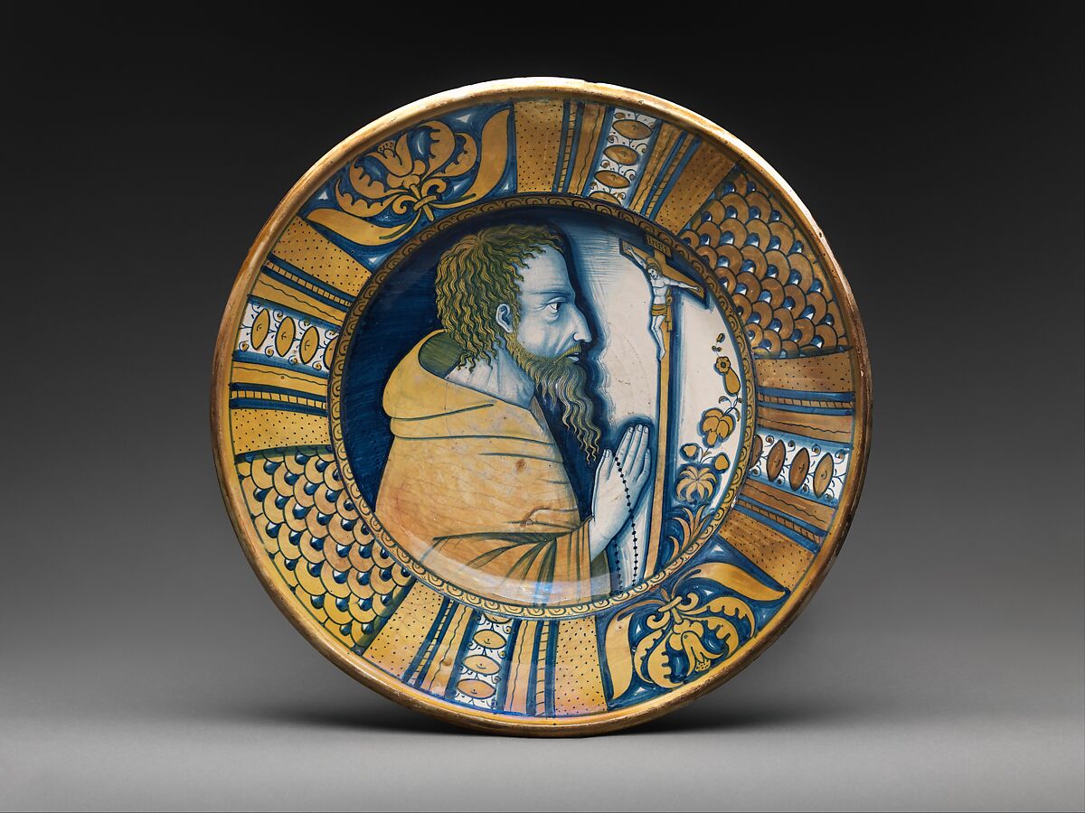 Dish with saint (Saint Francis?) or friar praying before crucifix, Maiolica (tin-glazed earthenware), lustered, Italian, Deruta 