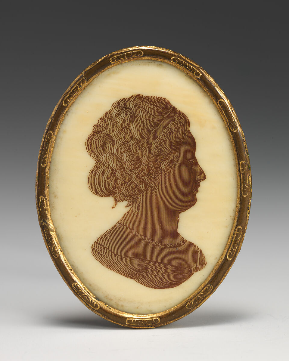 Head of a woman, Sepia on ivory, and brass, possibly German 