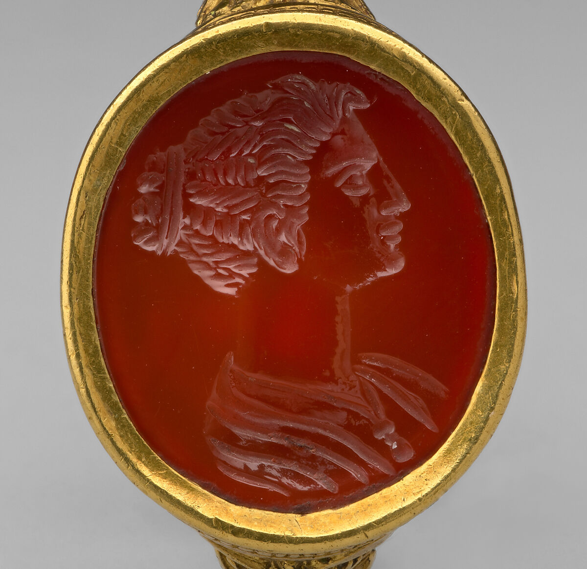 Head of a Maiden intaglio set in a ring, Carnelian and gold, Italian