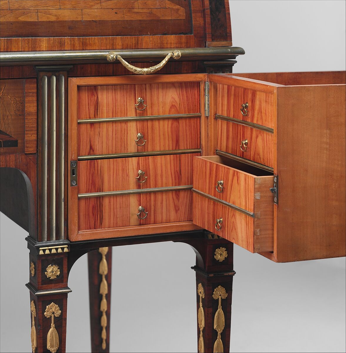 Rolltop desk, David Roentgen (German, Herrnhaag 1743–1807 Wiesbaden, master 1780), Oak, cherry, pine, mahogany, veneered with maple, burl woods, holly, hornbeam (all partially stained), tulipwood, mahogany, and other woods; mother-of-pearl; partially gilded and tooled leather; gilt bronze, iron, steel, brass, partially gold-lacquered brass, German, Neuwied am Rhein
