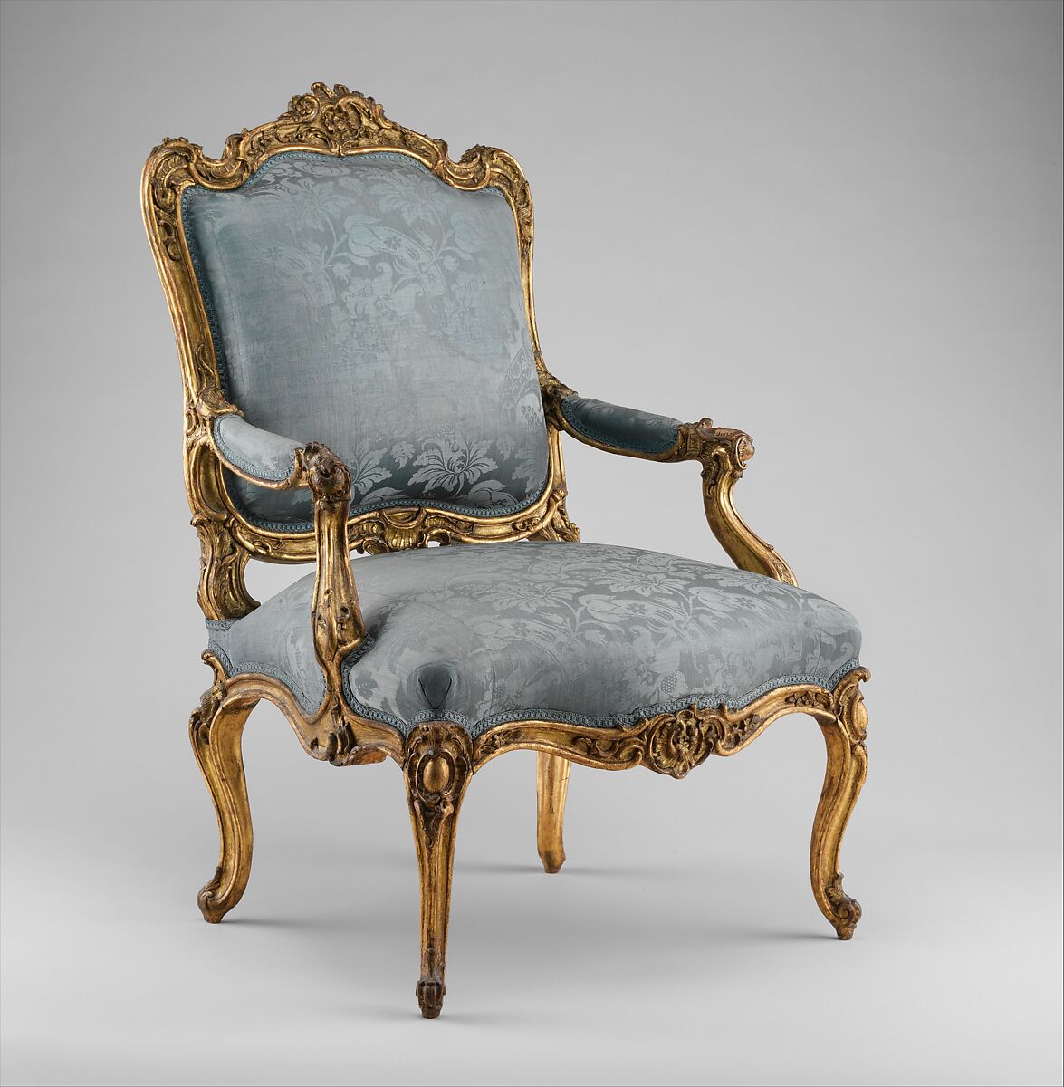 Armchair (fauteuil à la reine), Carved and gilded beech; covered in eighteenth-century blue damask not original to the armchair, Southwestern German 