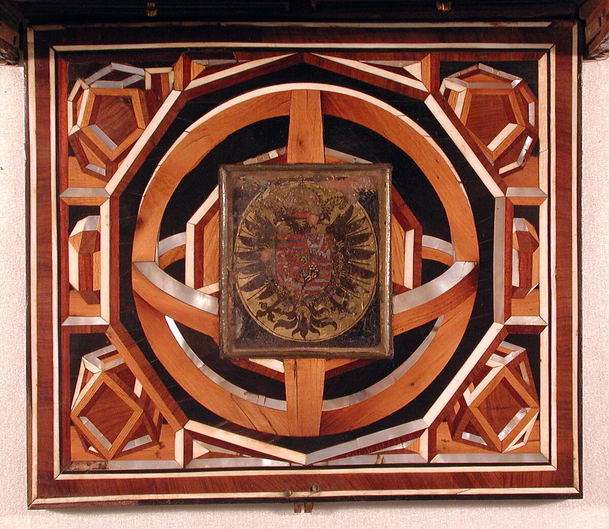 Miniature collector's cabinet, Ivory drawer decoration after a composition by Bernard Salomon (French, ca. 1508–ca. 1561), Dyed and gold-tooled leather on secondary woods pine, poplar, pear, yew; veneers of ivory, mother-of-pearl, pear, plum, ebony, rosewood, holly, ash, green stained poplar; gilded metal; reverse-painted glass, German, possibly Nuremberg