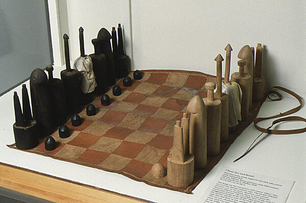Chess set, Limba wood, goatskin, cotton, Nigerian