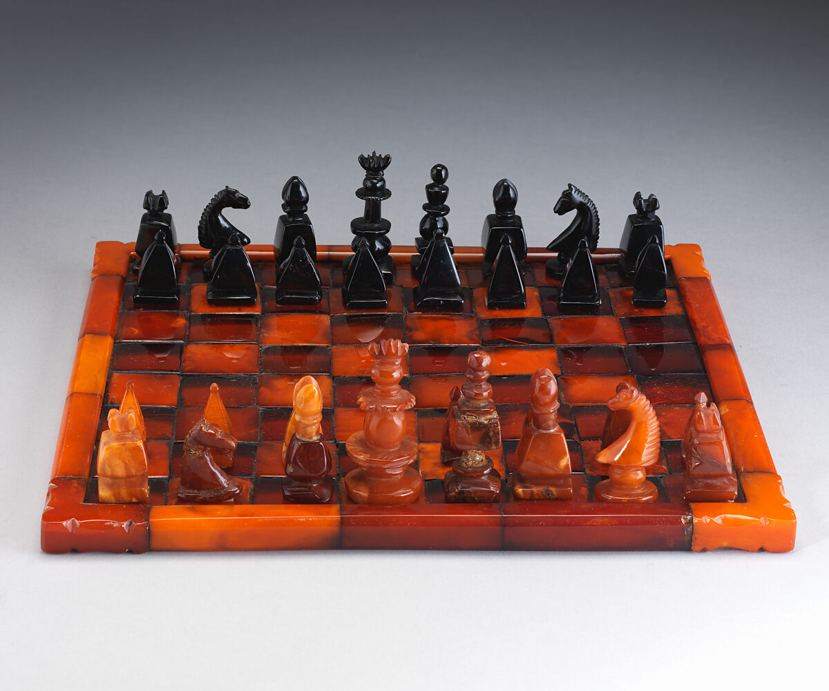 Chessmen (32) and board, Imitation amber, jet, British 