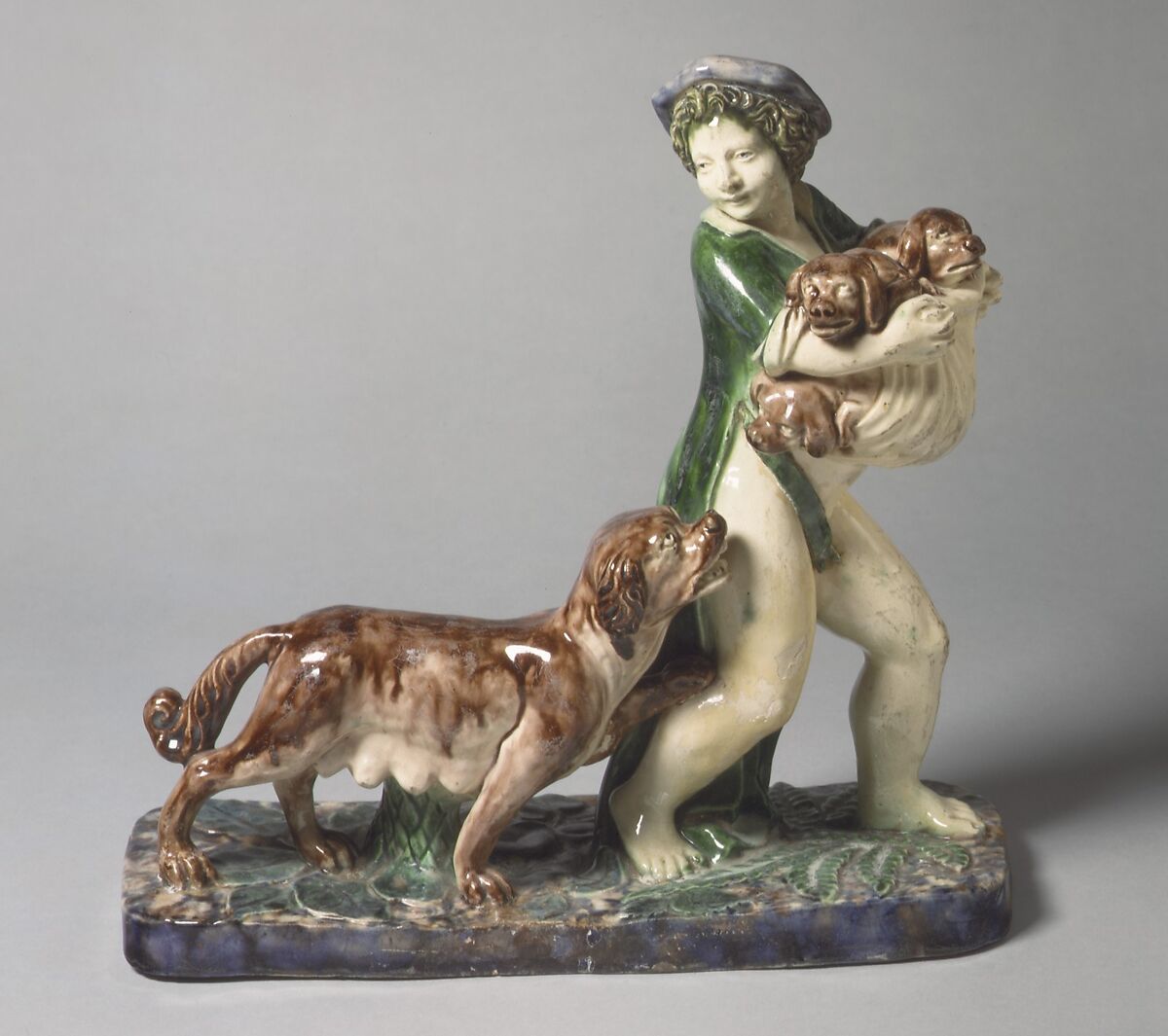 Boy carrying pups, Lead-glazed earthenware, French, Fontainebleau