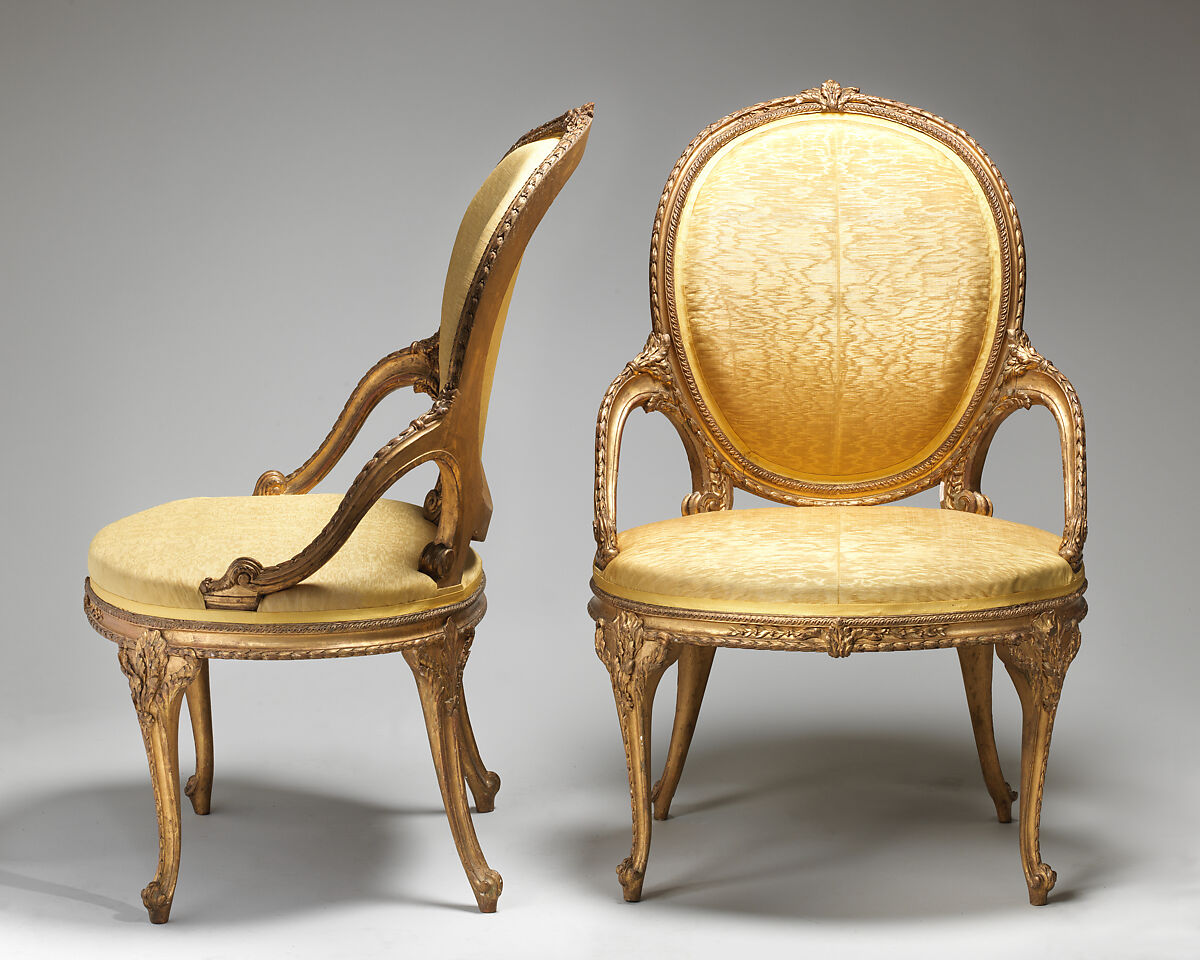Pair of armchairs (part of a set), Carved and gilt beech, moiré silk not original to the frames, British 