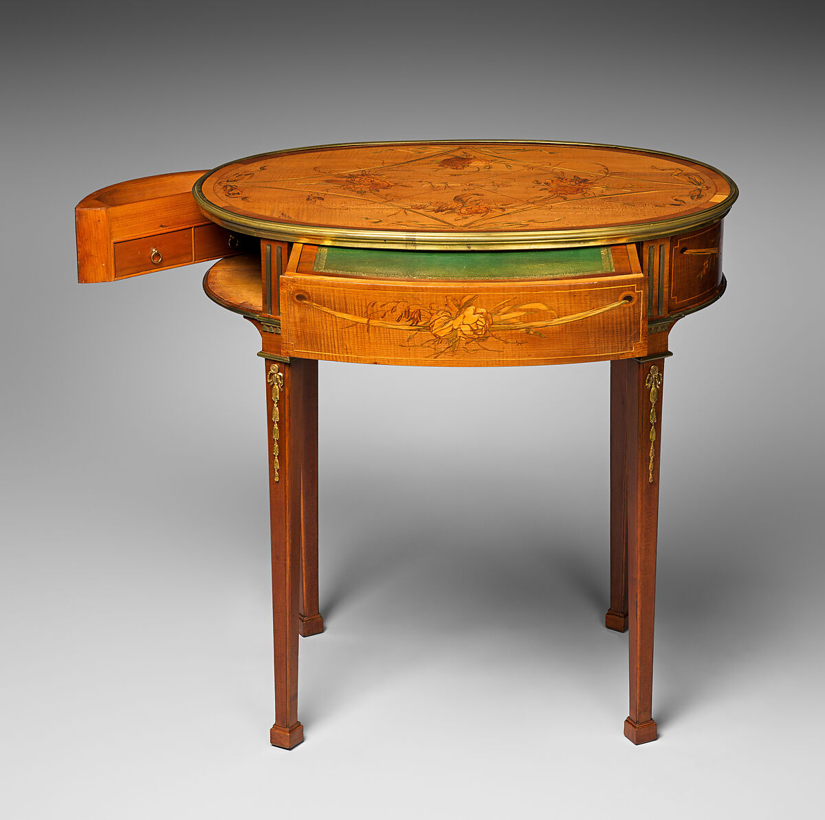 Oval table, Attributed to David Roentgen (German, Herrnhaag 1743–1807 Wiesbaden, master 1780), Oak, walnut, pine, cherry, and maple, veneered with maple, hornbeam, holly (all partially stained), cherry, mahogany, tulipwood, and other woods; gilt bronze, iron, brass, steel; partially tooled and gilded leather, German, Neuwied am Rhein