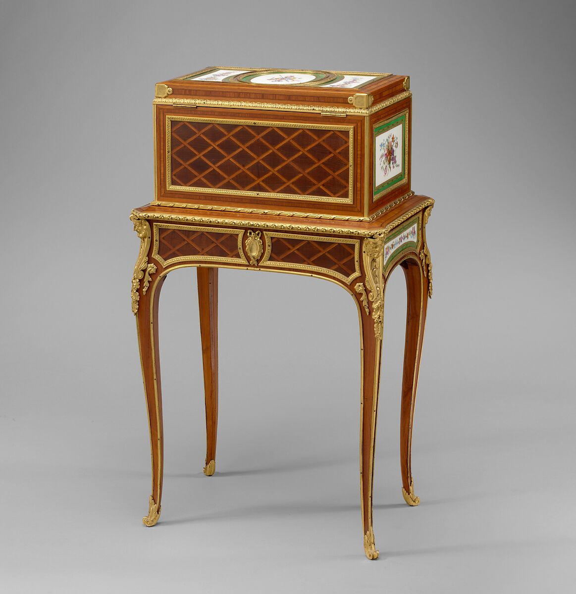 Jewel coffer on stand (petit coffre à bijoux), Coffer attributed to Martin Carlin (French, near Freiburg im Breisgau ca. 1730–1785 Paris), Oak veneered with tulipwood, amaranth, stained sycamore, holly, and ebonized holly; thirteen soft-paste porcelain plaques; gilt-bronze mounts; velvet (not original), French, Paris and Sèvres