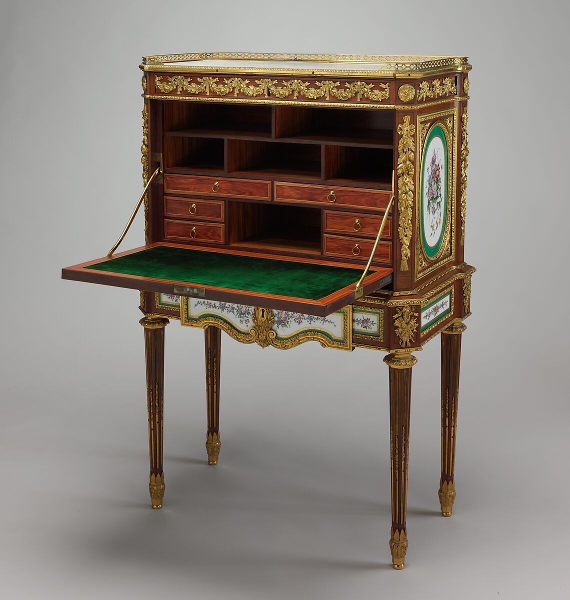 Drop-front desk (secrétaire à abattant or secrétaire en cabinet), Martin Carlin (French, near Freiburg im Breisgau ca. 1730–1785 Paris), Oak veneered with tulipwood, amaranth, holly, and ebonized holly; ten soft-paste porcelain plaques; gilt-bronze mounts; marble; velvet (not original), French, Paris and Sèvres