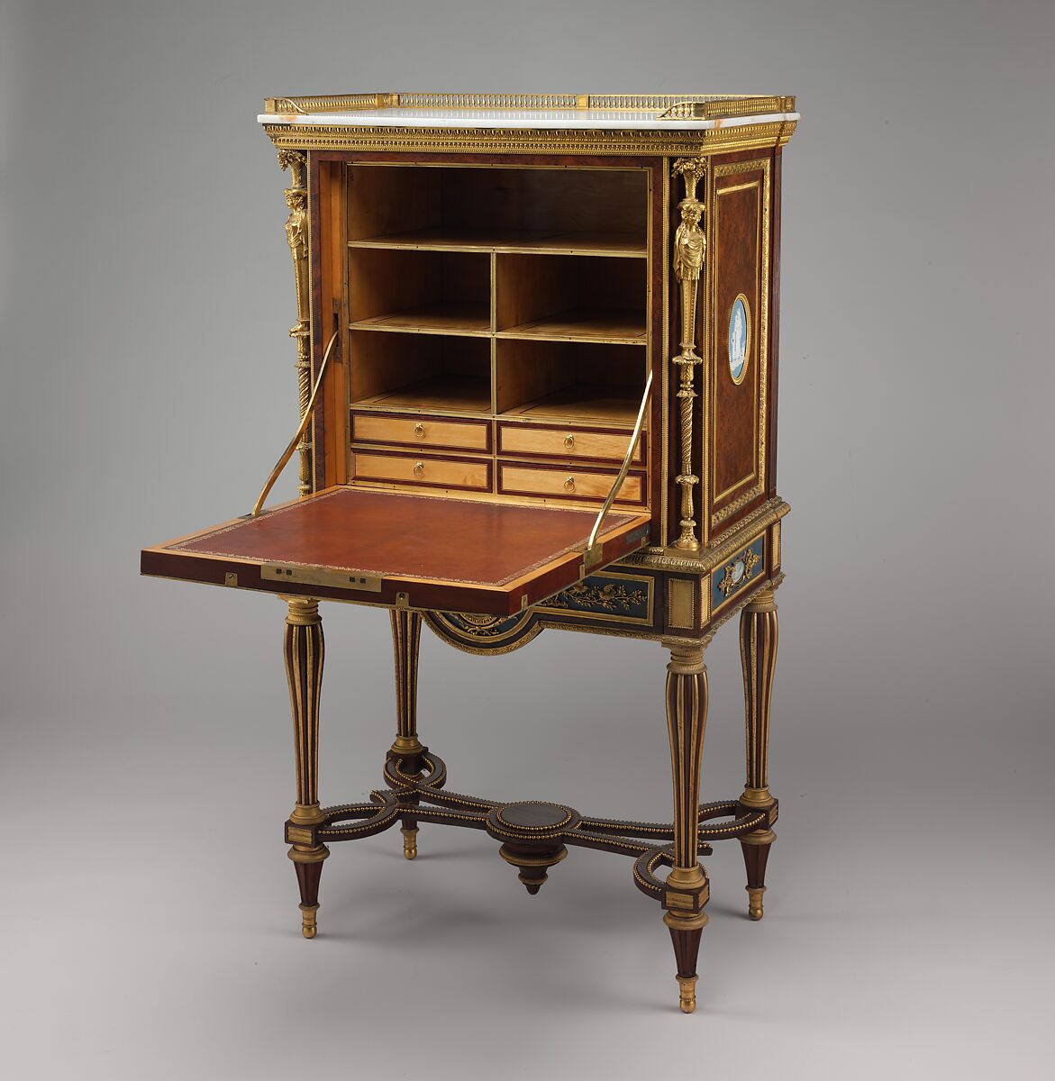 Drop-front desk (secrétaire à abattant or secrétaire en cabinet), Attributed to Adam Weisweiler (French, 1744–1820), Oak veneered with burl thuya, amaranth, mahogany, satinwood, holly, and ebonized holly; painted metal; one soft-paste porcelain plaque; fifteen jasper medallions; gilt-bronze mounts; marble; leather (not original), French, Paris and Sèvres