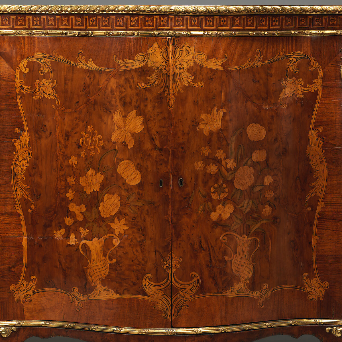 Commode, Attributed to John Mayhew (British, 1736–1811), Pine veneered with satinwood, mahogany, burl, yew, and purplewood; gilt bronze, British