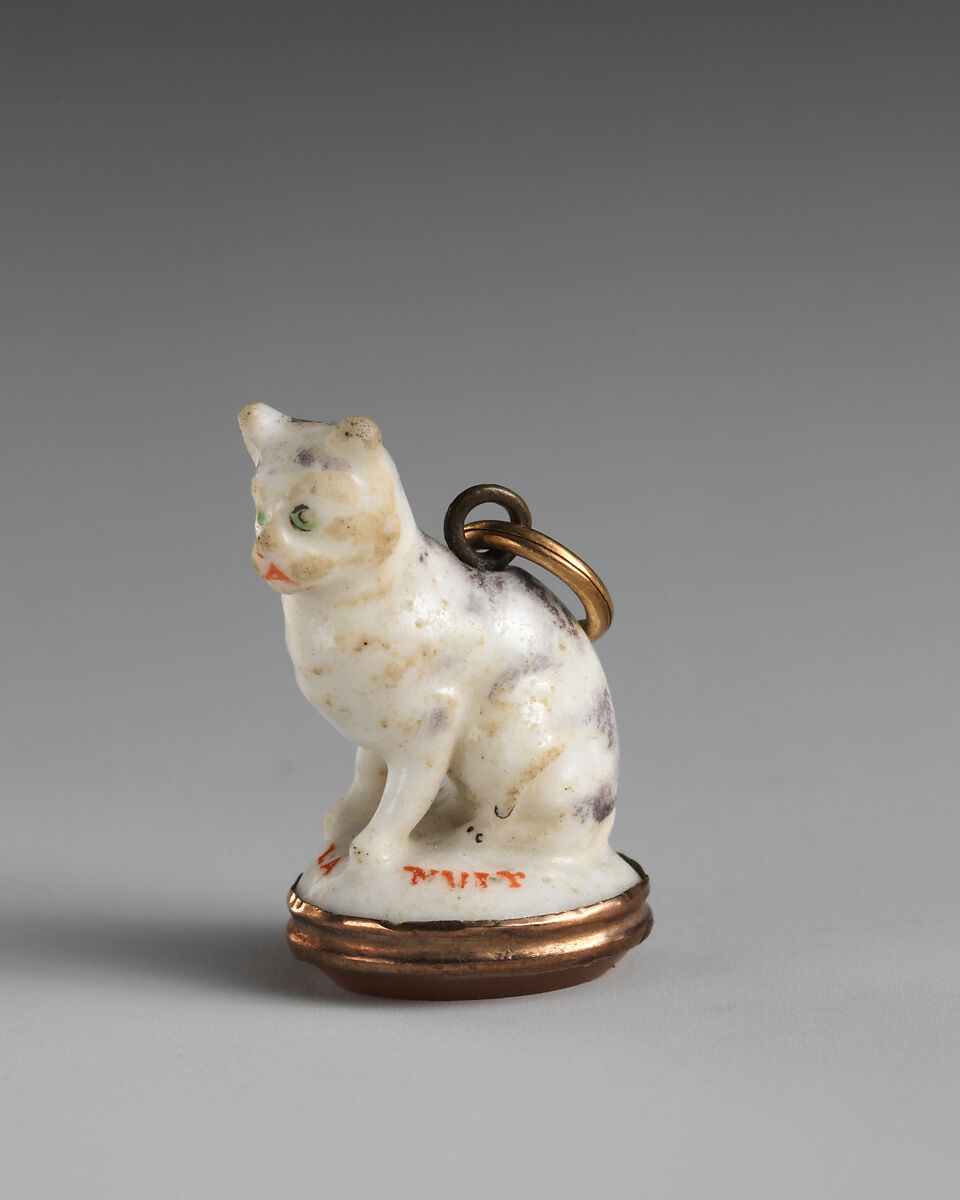 Miniature seal in the form of a cat, Chelsea Porcelain Manufactory (British, 1745–1784, Red Anchor Period, ca. 1753–58), Soft-paste porcelain, carnelian, metal, gilt metal, British, Chelsea