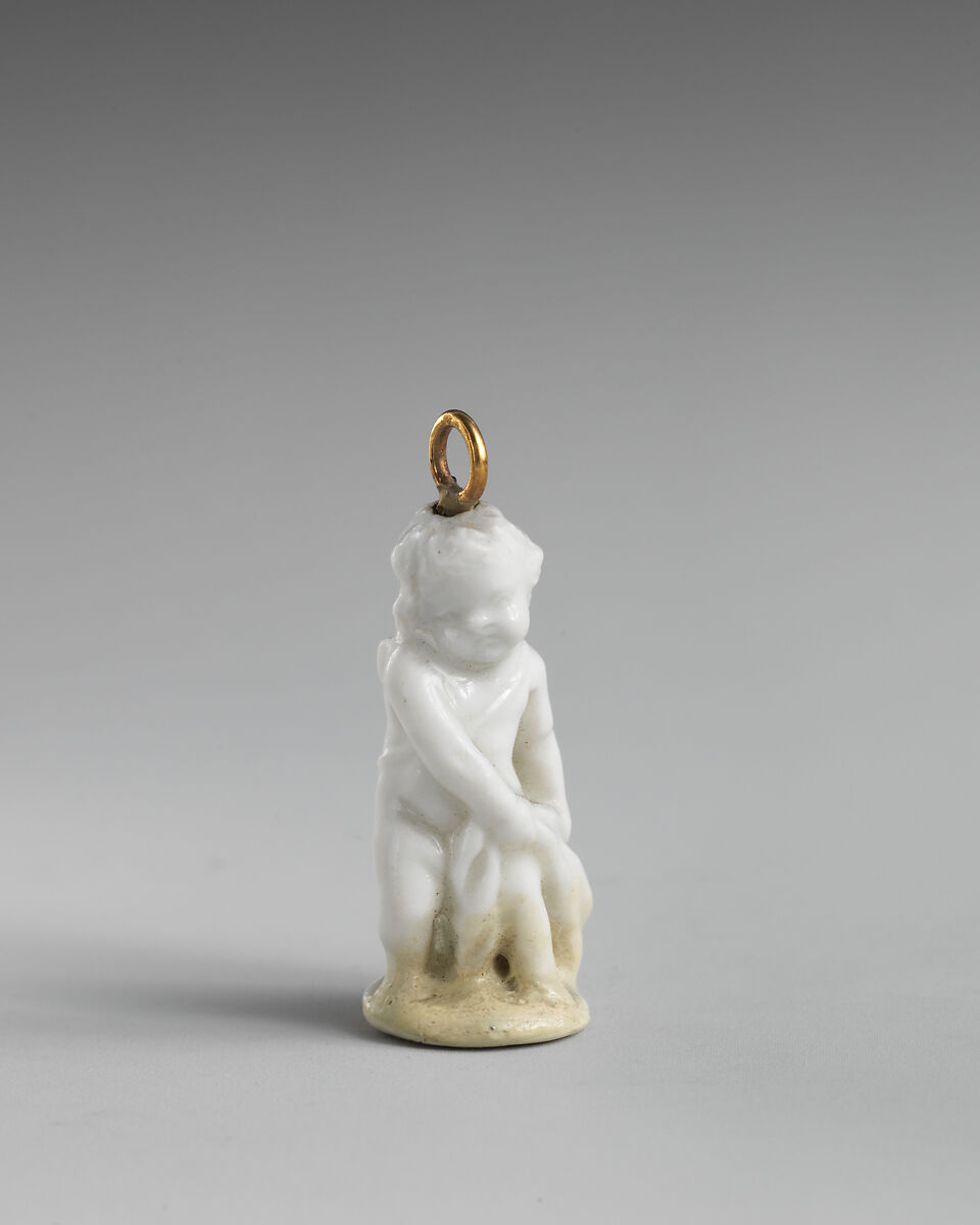 Miniature seal in the form of Cupid, Chelsea Porcelain Manufactory (British, 1745–1784, Red Anchor Period, ca. 1753–58), Soft-paste porcelain, copper gilt, British, Chelsea 