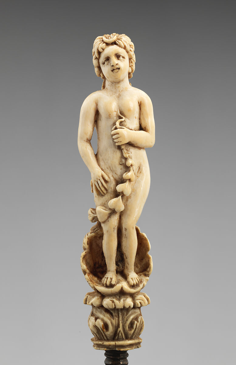 Knife with carved handle of nude female with crescent in hair standing in a half shell holding a swag, Steel gilt, ivory, Italian