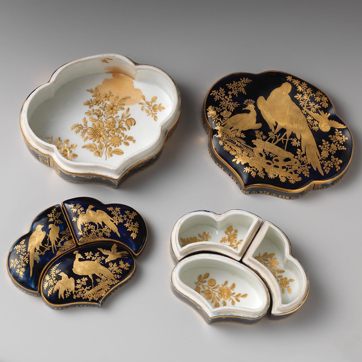Toilet set containing three smaller boxes, Chelsea Porcelain Manufactory (British, 1744–1784), Soft-paste porcelain, Mazarin blue ground with gold decoration, British, Chelsea