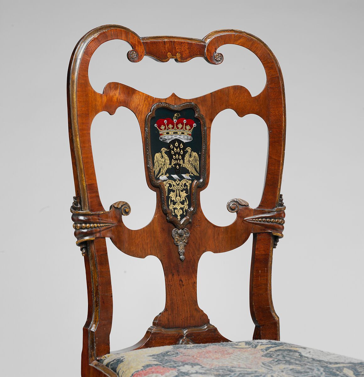 Pair of side chairs, Attributed to Thomas How (British, active 1710–33), Walnut and walnut veneer, parcel-gilt, the seat rails of beech; gilded lead mounts on the knees and front rail; verre églomisé panel mounted on the splat; covered in contemporary tent stitch embroidery on canvas needlework not original to the chair, British
