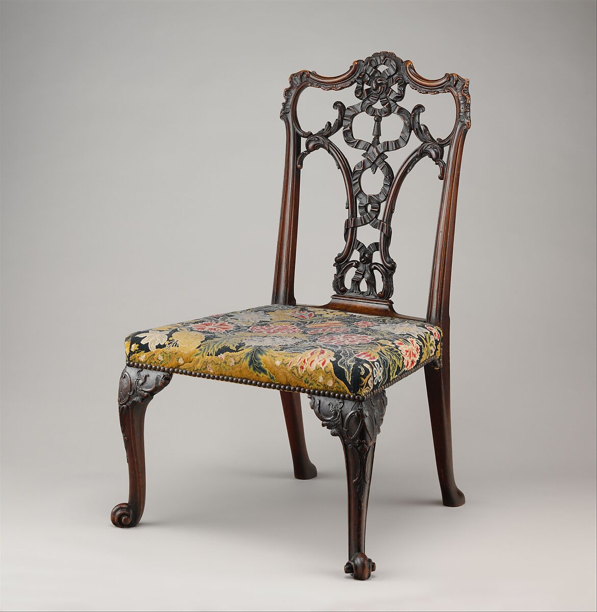 Side chair (one of a pair), After a design by Thomas Chippendale (British, baptised Otley, West Yorkshire 1718–1779 London), Mahogany; tent stitch embroidery on canvas, British