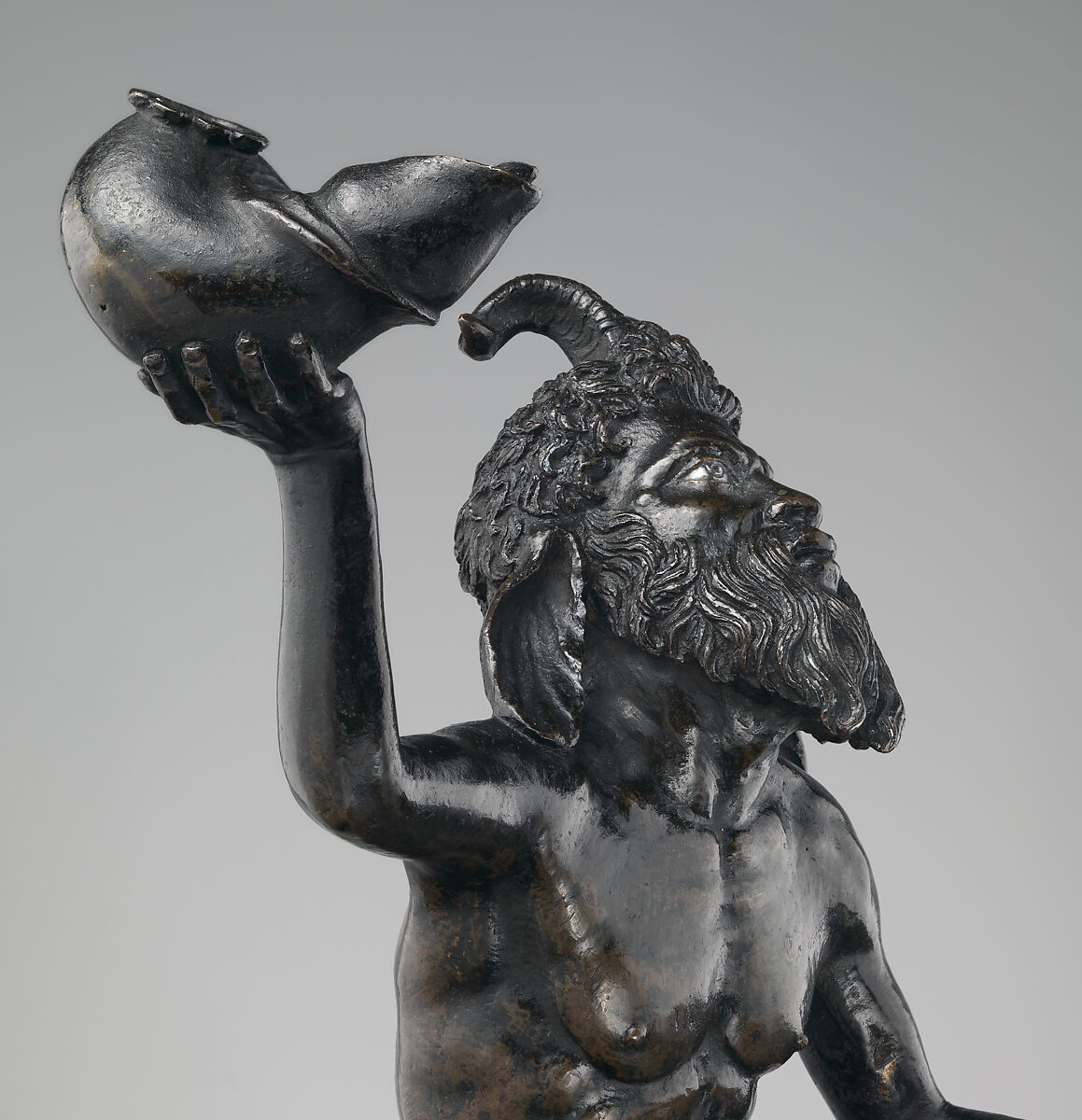 Seated satyr with silvered eyes, Andrea Briosco, called Riccio (Italian, Trent 1470–1532 Padua), Bronze, silver inlay (eyes), Italian, Padua