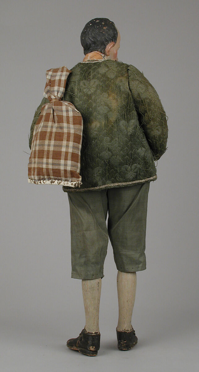 Shepherd with lamb in shoulder bag, Polychromed terracotta head and lamb; wooden limbs; body of wire wrapped in tow; silk, cotton and suede garments; silver metal coiled wire buttons and gold vest, Italian, Naples