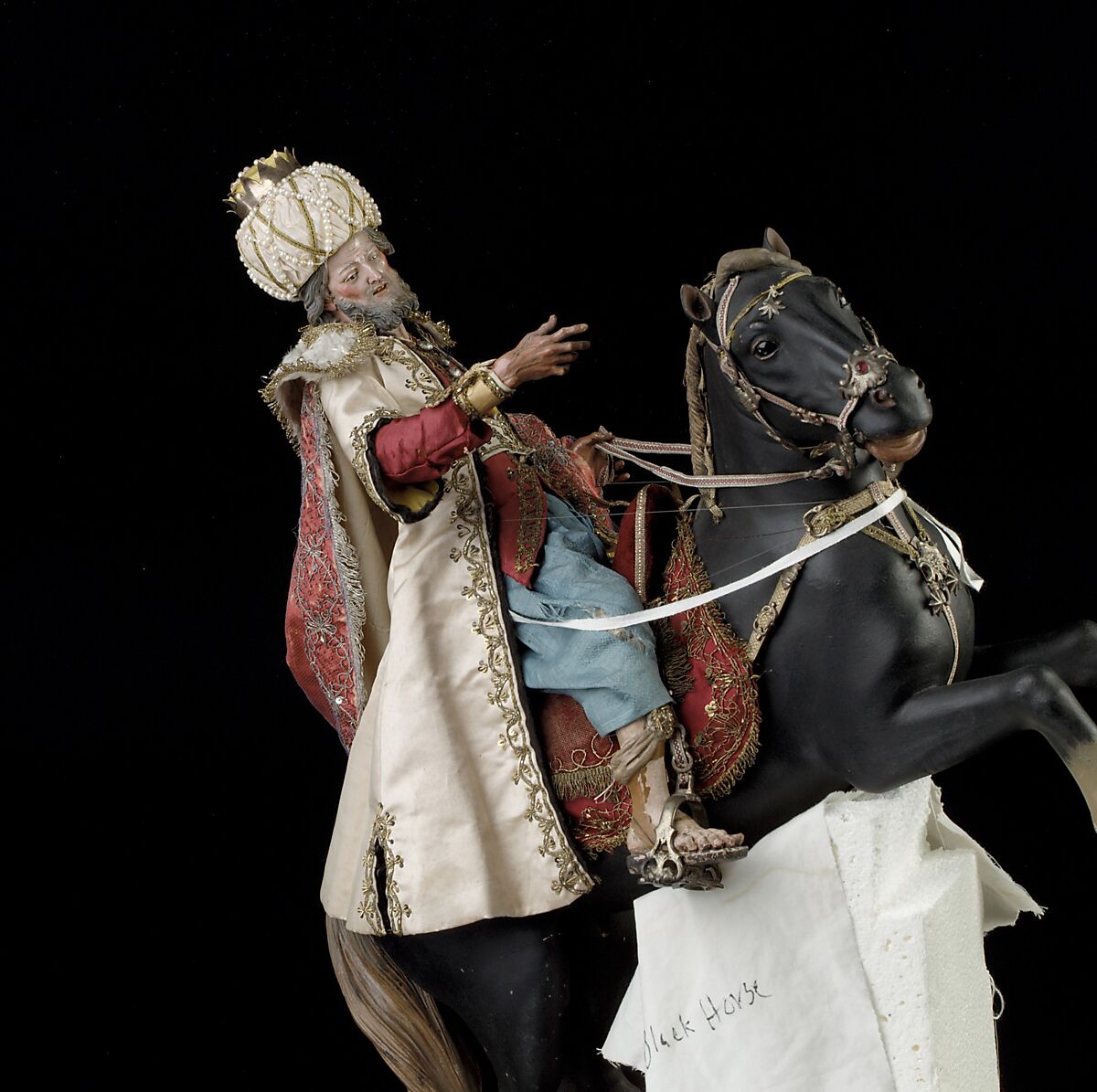 Elderly king, Polychromed terracotta head and wooden limbs; body of wire wrapped in tow; silk and satin garments; silver and gold metallic thread; glass buttons; silver-gilt sword, hilt and crown; leather sheath, Italian, Naples