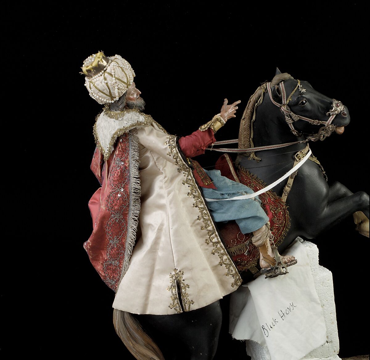Elderly king, Polychromed terracotta head and wooden limbs; body of wire wrapped in tow; silk and satin garments; silver and gold metallic thread; glass buttons; silver-gilt sword, hilt and crown; leather sheath, Italian, Naples