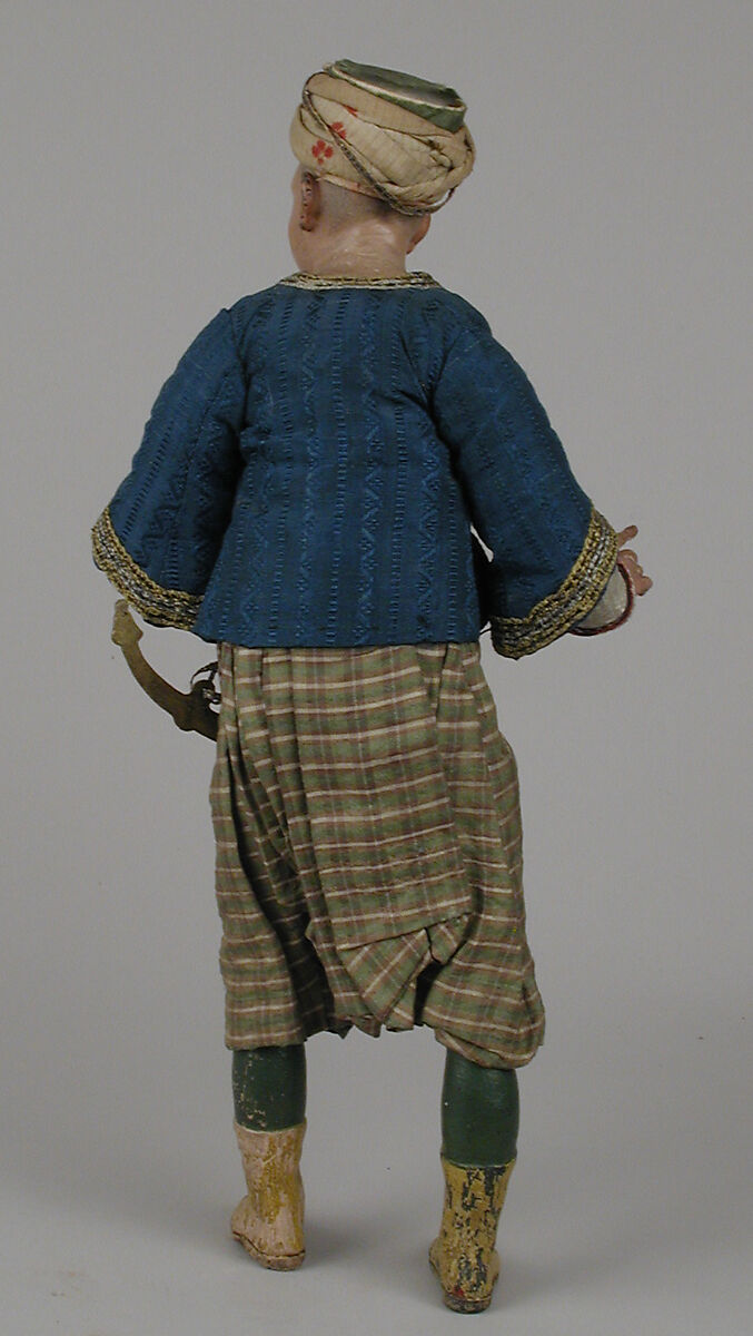 King's attendant, Polychromed terracotta head and wooden limbs; body of wire wrapped in tow; silk and satin garments with silver and gold metallic thread; brass sword, Italian, Naples