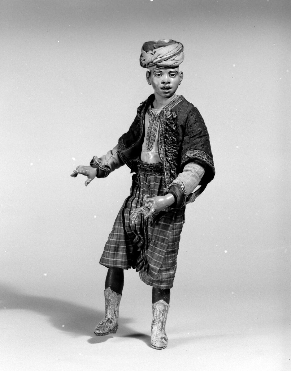 King's attendant, Polychromed terracotta head and wooden limbs; body of wire wrapped in tow; silk and satin garments with silver and gold metallic thread; brass sword, Italian, Naples