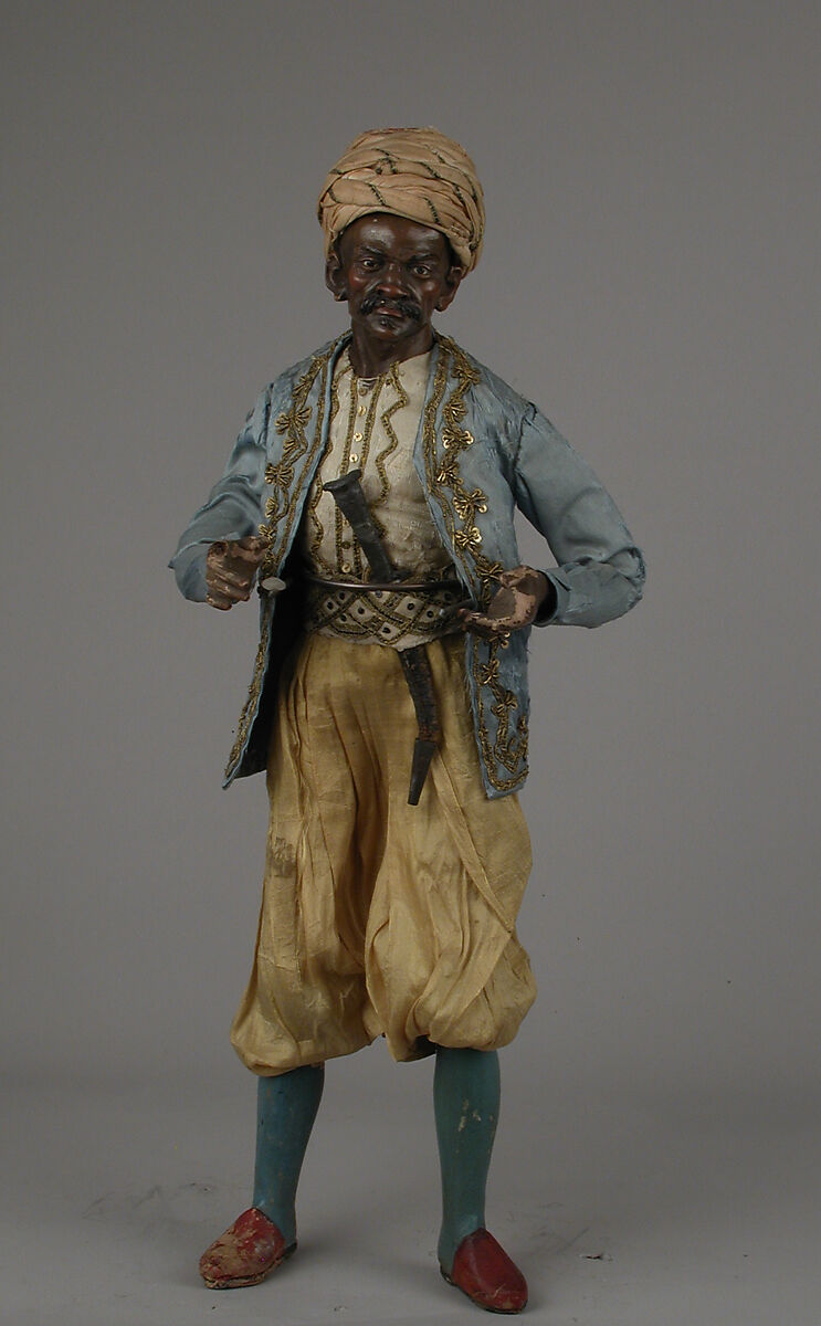 King's attendant, Giovanbattista Polidoro (Italian), Polychromed terracotta head and wooden limbs; body of wire wrapped in tow; silk garments with silver and gold metallic thread; silk and cotton turban; metal dagger in leather sheath, Italian, Naples 