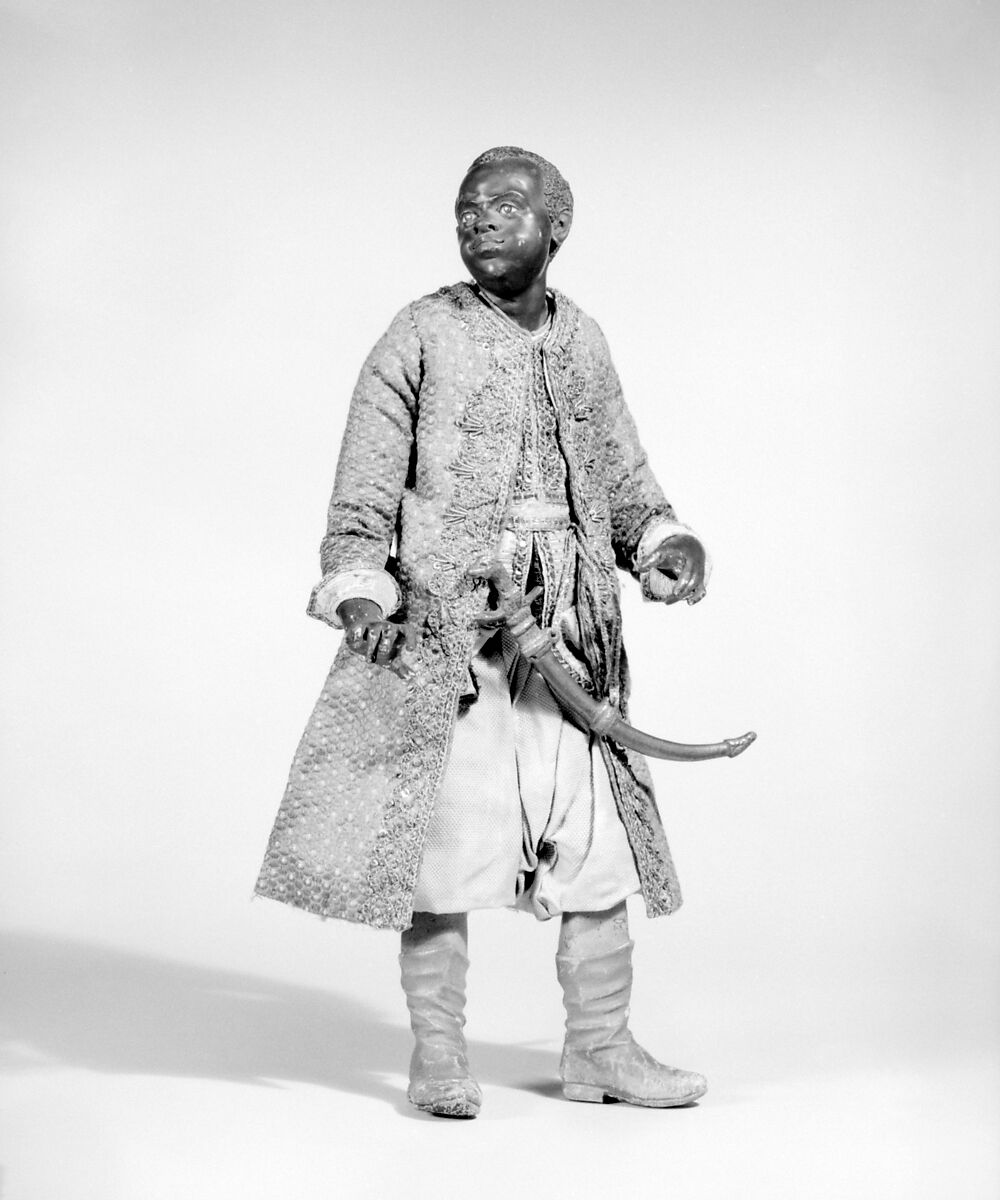 King's Moorish attendant, Polychromed terracotta head and wooden limbs; body of wire wrapped in tow; cotton and silk garments with silver and gold metallic thread; brass sword, Italian, Naples