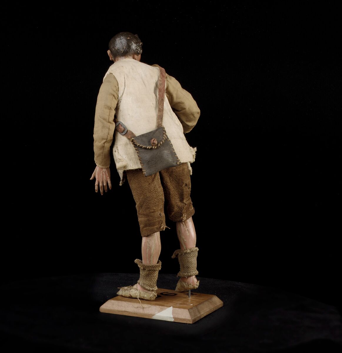 Shepherd, Polychromed terracotta head and wooden limbs; body of wire wrapped in tow; cotton and burlap garments; leather belt, shoes and shoulder bag, Italian, Naples