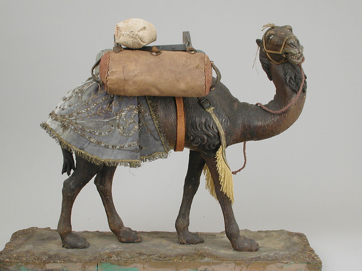 Camel, Polychromed wooden body covered with stucco; wooden saddle and leather girth straps; burlap cushion and leather saddlebags, Italian, Naples
