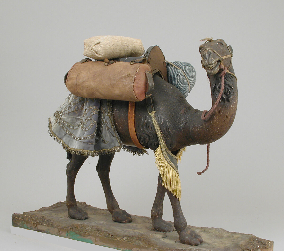 Camel, Polychromed wooden body covered with stucco; wooden saddle and leather girth straps; burlap cushion and leather saddlebags, Italian, Naples