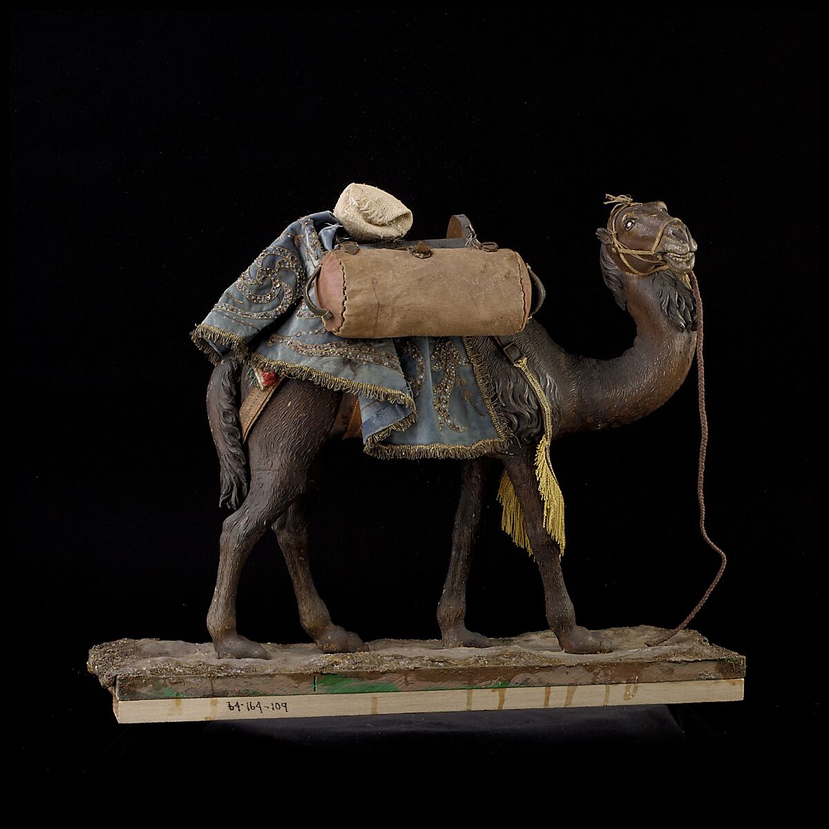 Camel, Polychromed wooden body covered with stucco; wooden saddle and leather girth straps; burlap cushion and leather saddlebags, Italian, Naples