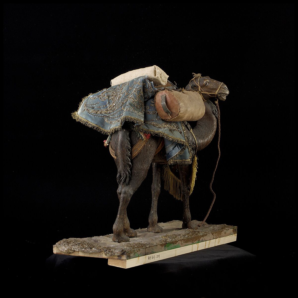 Camel, Polychromed wooden body covered with stucco; wooden saddle and leather girth straps; burlap cushion and leather saddlebags, Italian, Naples