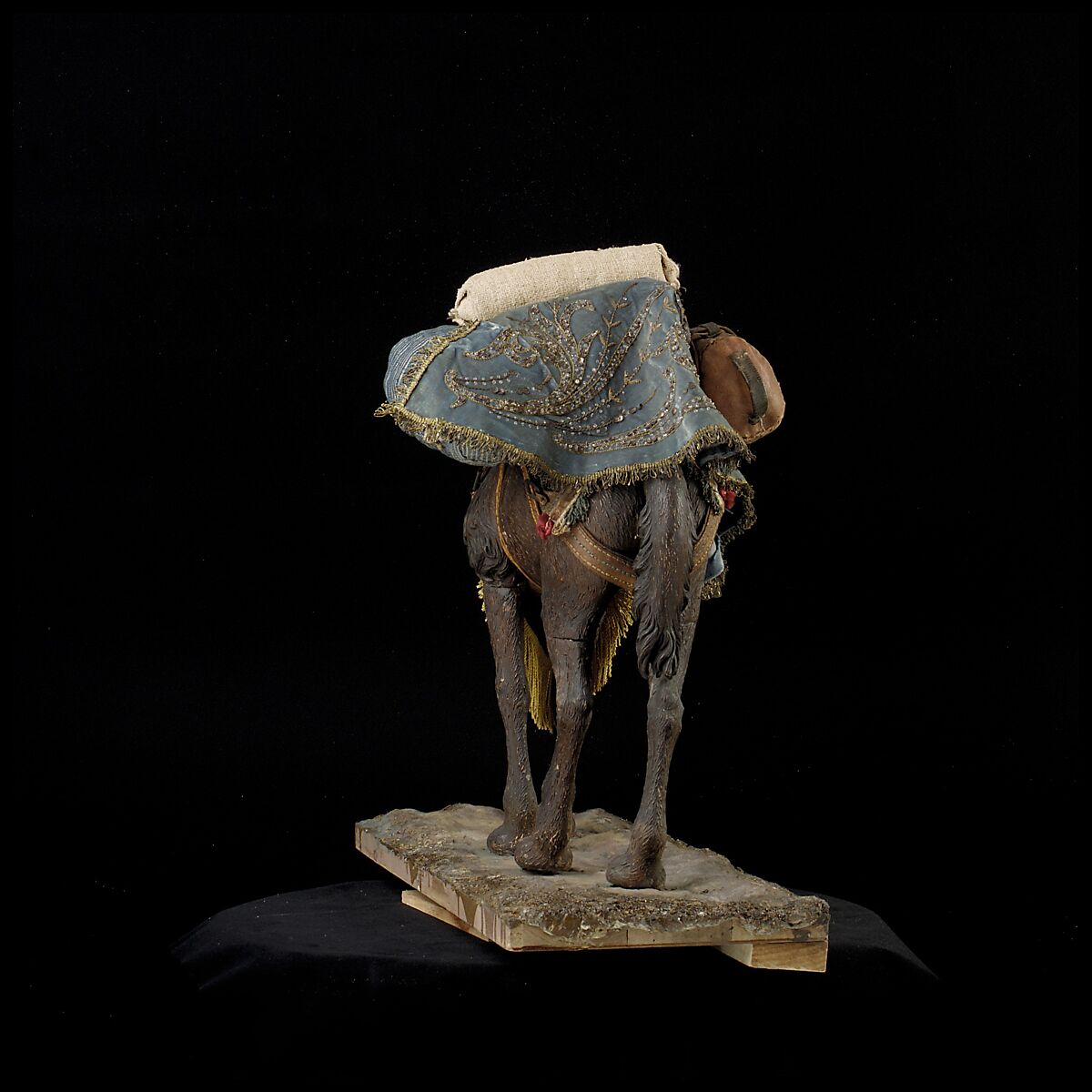 Camel, Polychromed wooden body covered with stucco; wooden saddle and leather girth straps; burlap cushion and leather saddlebags, Italian, Naples
