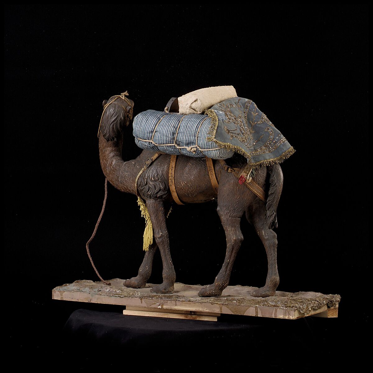 Camel, Polychromed wooden body covered with stucco; wooden saddle and leather girth straps; burlap cushion and leather saddlebags, Italian, Naples