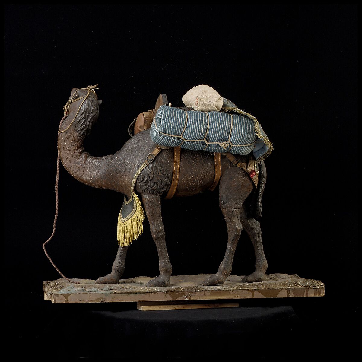 Camel, Polychromed wooden body covered with stucco; wooden saddle and leather girth straps; burlap cushion and leather saddlebags, Italian, Naples
